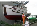 This fishing vessel does duty in retirement as a refreshment advertisement!